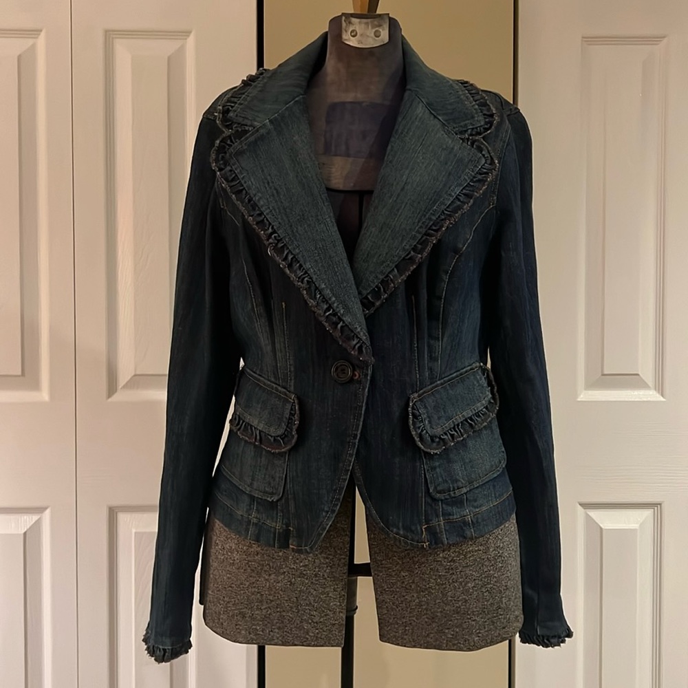 This denim jacket is super cute with the added ruffles.